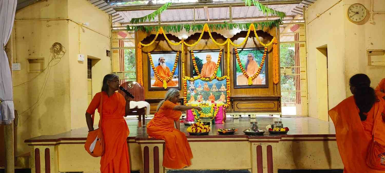 Mataji walking through campus with students
